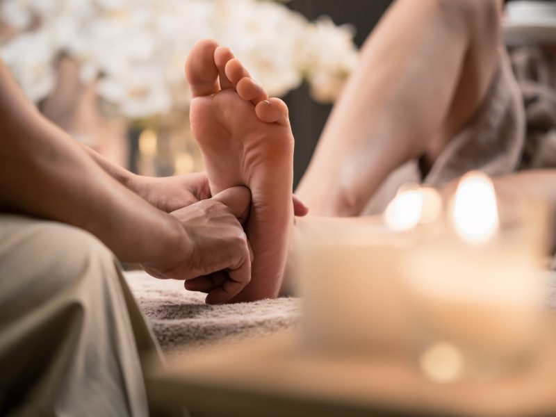 Santani client at a treatment after wondering "Can Foot Reflexology Help Sciatica Pain"